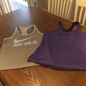 Set of two Women’s Nike racer back tops.